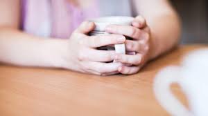 Hands around a warm drink